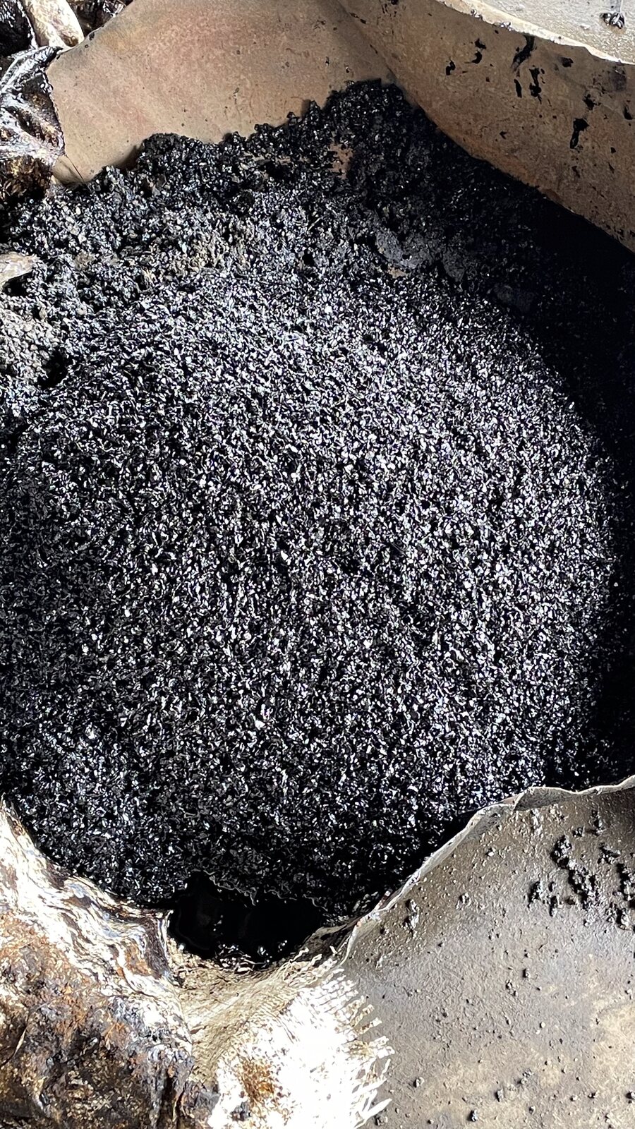 Close view of black bituminous material texture